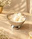 Silver-finish line bowl filled with white scented wax candle, by Deziworkz